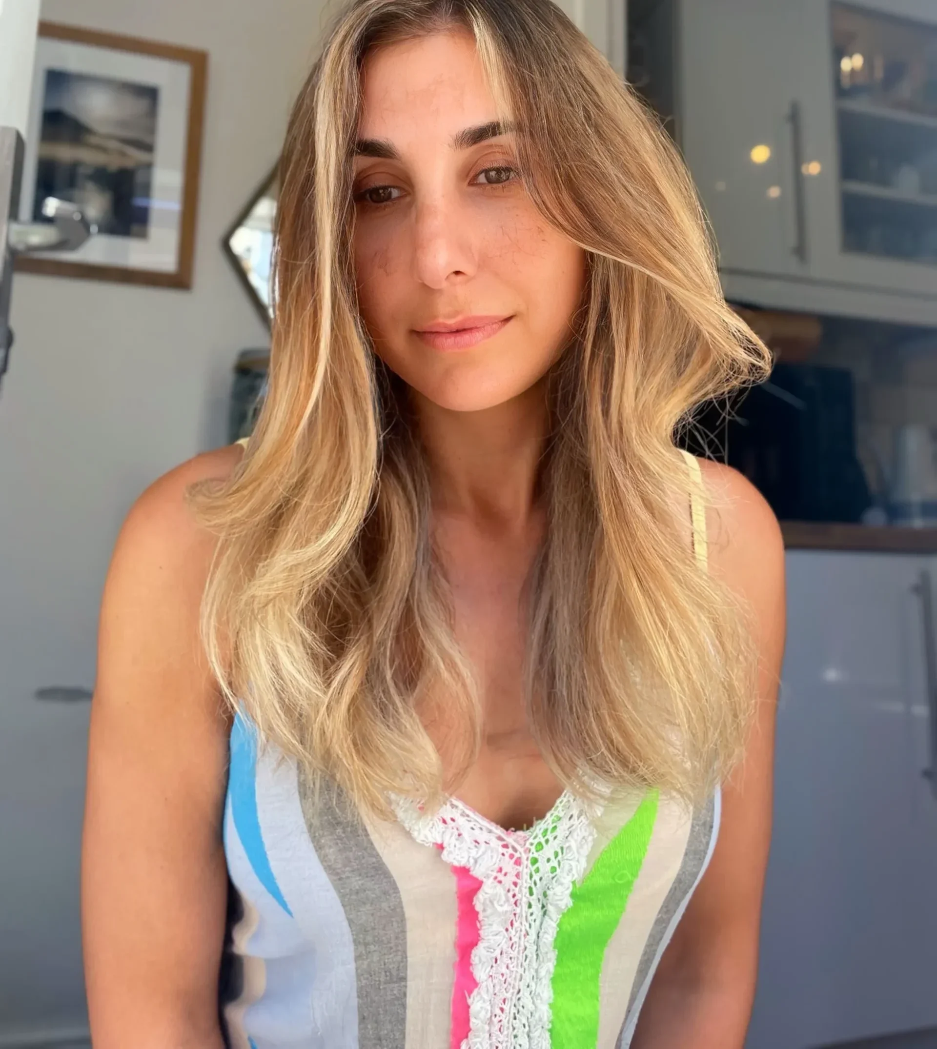 Client posing very happy after a balayage hair service in Carlisle, Cumbria.